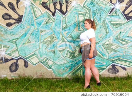 Well dressed young woman despite overweight 70916004