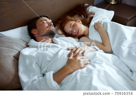 beautiful couple sleep together on bed beautiful couple sleep together on bed 70916358