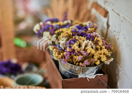 Colorful dry flowers bouquet in bucket Colorful dry flowers bouquet in bucket 70916408
