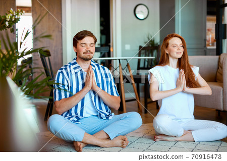 beautiful couple practice yoga, meditate beautiful couple practice yoga, meditate 70916478