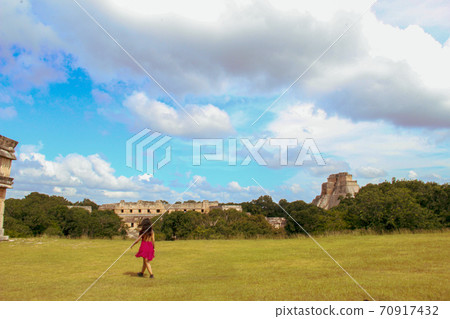 Woman at ruins of the ancient city of Uxmal in Merida, Mexico Woman at ruins of the ancient city of Uxmal in Merida, Mexico 70917432
