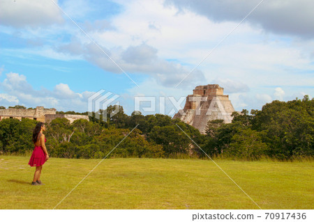 Woman at ruins of the ancient city of Uxmal in Merida, Mexico Woman at ruins of the ancient city of Uxmal in Merida, Mexico 70917436