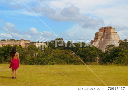 Woman at ruins of the ancient city of Uxmal in Merida, Mexico Woman at ruins of the ancient city of Uxmal in Merida, Mexico 70917437
