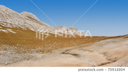 dry mountain tundra on a highland plateau on a clear day 70918804