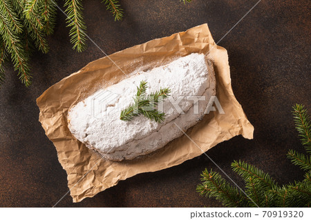 Christmas stollen - German bread on brown. Christmas stollen - German bread on brown. 70919320