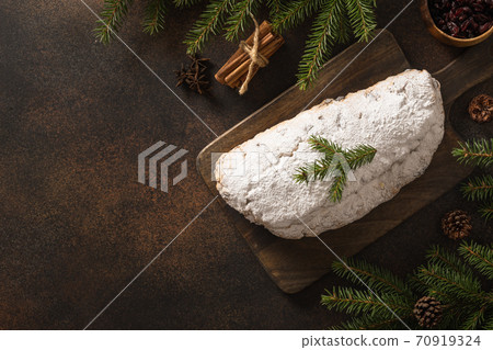 Christmas stollen - German bread on brown. Christmas stollen - German bread on brown. 70919324