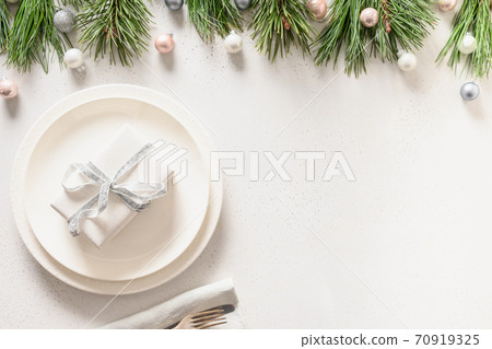 Christmas table setting with white gift 70919325