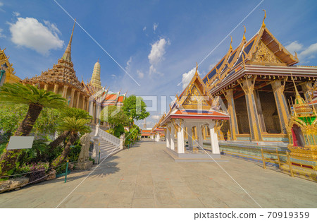 Golden pagoda at Temple of the Emerald Buddha in Bangkok, Thailand. Wat Phra Kaew and Grand palace in old town, urban city. Buddhist temple, Thai architecture. A tourist attraction 70919359