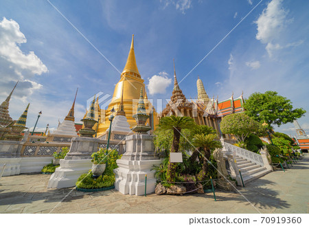 Golden pagoda at Temple of the Emerald Buddha in Bangkok, Thailand. Wat Phra Kaew and Grand palace in old town, urban city. Buddhist temple, Thai architecture. A tourist attraction 70919360