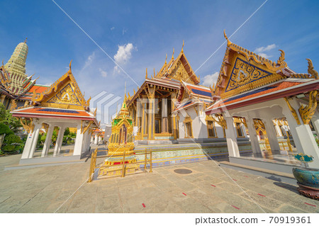 Golden pagoda at Temple of the Emerald Buddha in Bangkok, Thailand. Wat Phra Kaew and Grand palace in old town, urban city. Buddhist temple, Thai architecture. A tourist attraction 70919361