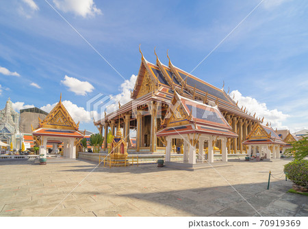 Golden pagoda at Temple of the Emerald Buddha in Bangkok, Thailand. Wat Phra Kaew and Grand palace in old town, urban city. Buddhist temple, Thai architecture. A tourist attraction 70919369