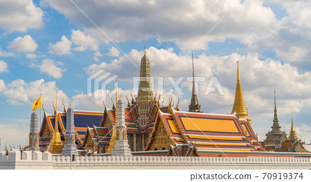 Golden pagoda at Temple of the Emerald Buddha in Bangkok, Thailand. Wat Phra Kaew and Grand palace in old town, urban city. Buddhist temple, Thai architecture. A tourist attraction 70919374