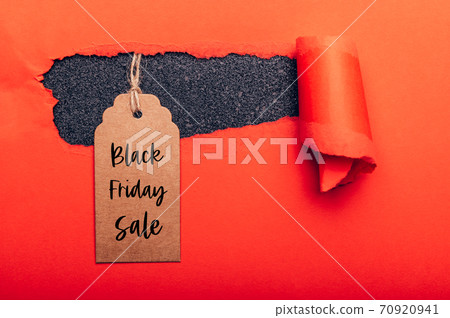 Words Black Friday Sale written on tag 70920941