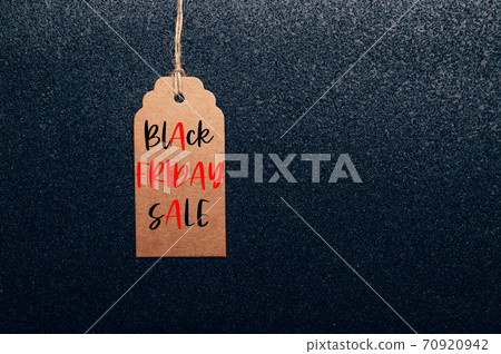 Words Black Friday Sale written on tag 70920942