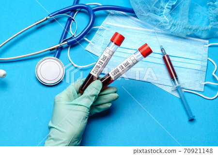 lab technician assistant or doctor holding a blood sample in test tube at laboratory lab technician assistant or doctor holding a blood sample in test tube at laboratory 70921148