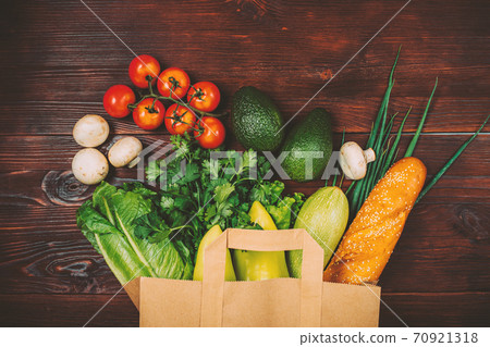 Paper shopping package with fresh vegetables 70921318