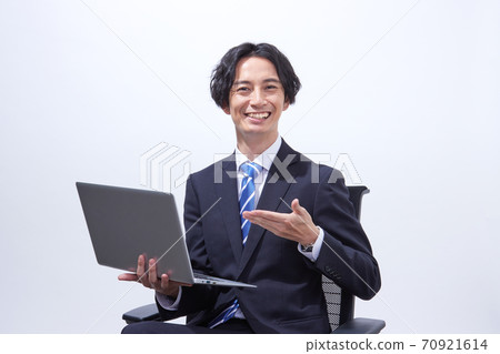 Portrait of a businessman with a personal computer 70921614