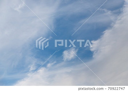 Cirrocumulus clouds in the light blue sky background Cirrocumulus clouds in the light blue sky background 70922747