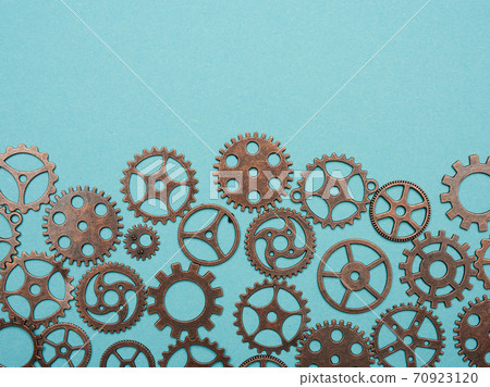 copper various cogs on a blue background 70923120