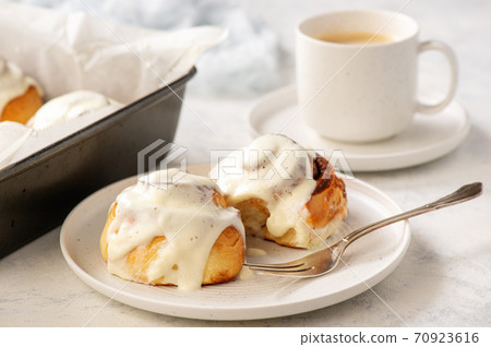 Homemade cinnamon buns with cream cheese icing. Homemade cinnamon buns with cream cheese icing. 70923616