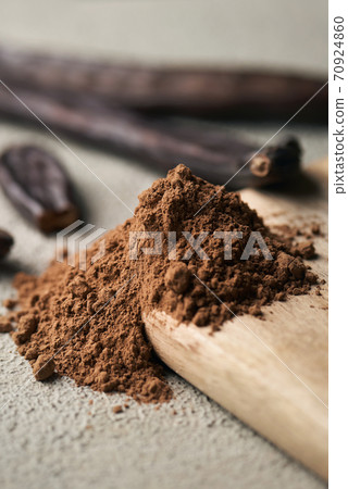 carob powder and ripe carob pods 70924860