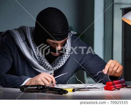 Terrorist bomber preparing dynamite bomb 70925535