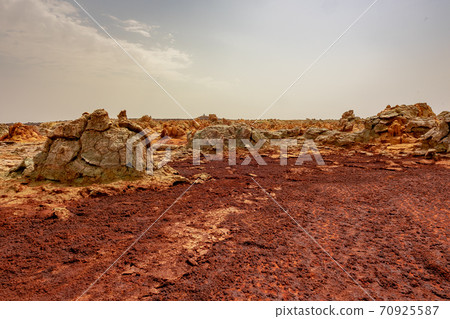 Mysterious scenery and sky near Dallol volcano, stopped by on a tour of the Danakil Desert in Ethiopia Mysterious scenery and sky near Dallol volcano, stopped by on a tour of the Danakil Desert in Ethiopia 70925587
