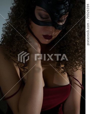 Mysterious woman in BDSM bondage 70926394