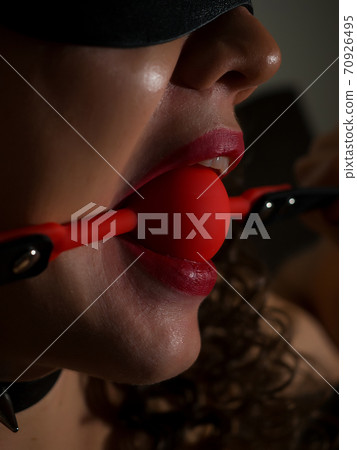 Sexual woman with ball gag in mouth 70926495
