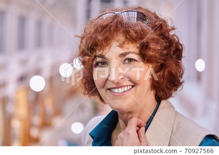 Happy white senior woman portrait inside shopping mall. Happy white senior woman portrait inside shopping mall. 70927566