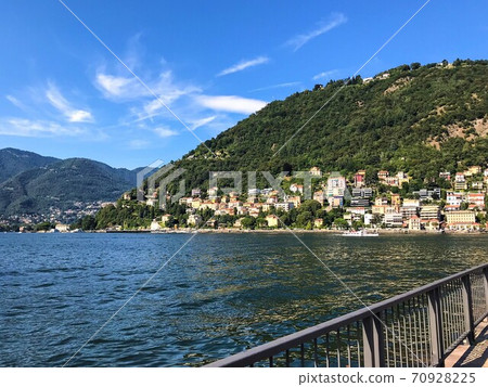View to the city of Como over the Lake Como, on Summer vacation in Lombardy, Italy View to the city of Como over the Lake Como, on Summer vacation in Lombardy, Italy 70928225