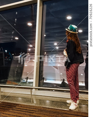 Waiting for delayed flight in airport at night. Waiting for delayed flight in airport at night. 70928226