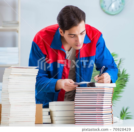 Worker in publishing house preparing book order Worker in publishing house preparing book order 70928429