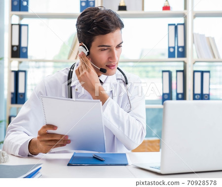 Young male doctor in telehealth concept 70928578