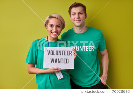 two caucasian man and woman waiting for new people in their charity organization 70928683