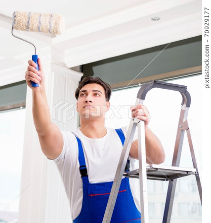 Painter repairman working at construction site Painter repairman working at construction site 70929177