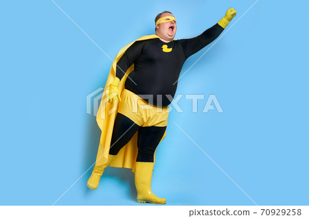 enthusiastic cleaning superhero isolated over blue background enthusiastic cleaning superhero isolated over blue background 70929258