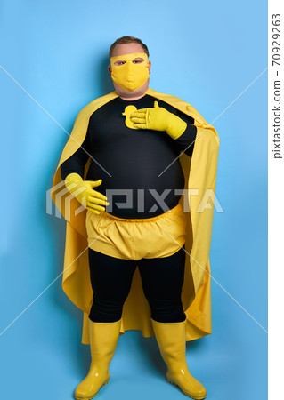 superhero fat male in mask and protective gloves 70929263