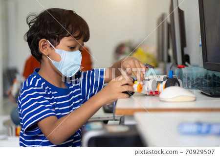 Boy wear face masks to prevent the Coronavirus 2019 (COVID-19) in schools. Boy wear face masks to prevent the Coronavirus 2019 (COVID-19) in schools. 70929507