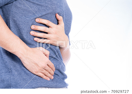 Man hand touching stomach, waist, or liver position isolated white background. Man hand touching stomach, waist, or liver position isolated white background. 70929727