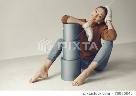 Beautiful girl in a studio with presents 70930043