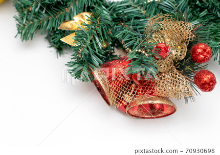 Christmas wreath made from fir branches with Christmas red bells. Decorations for christmas Christmas wreath made from fir branches with Christmas red bells. Decorations for christmas 70930698