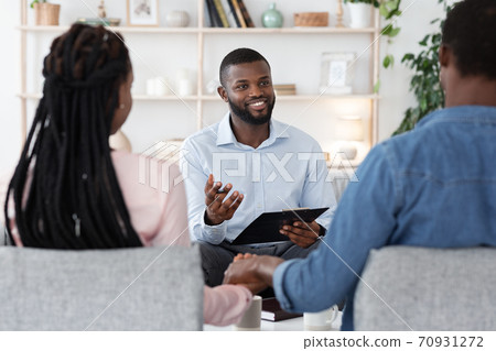 Couples Therapy Session. Counselor Talking To Black Husband And Wife At Office Couples Therapy Session. Counselor Talking To Black Husband And Wife At Office 70931272