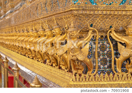 Garuda statue at Golden pagoda at Temple of the Emerald Buddha in Bangkok, Thailand. Wat Phra Kaew and Grand palace in old town, urban city. Buddhist temple, Thai architecture. 70931908