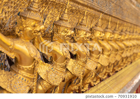 Garuda statue at Golden pagoda at Temple of the Emerald Buddha in Bangkok, Thailand. Wat Phra Kaew and Grand palace in old town, urban city. Buddhist temple, Thai architecture. 70931910