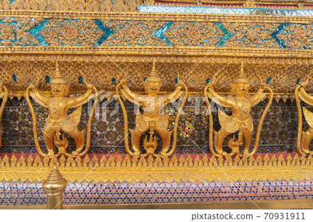 Garuda statue at Golden pagoda at Temple of the Emerald Buddha in Bangkok, Thailand. Wat Phra Kaew and Grand palace in old town, urban city. Buddhist temple, Thai architecture. 70931911
