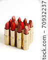 cosmetic lipstick, opened tubes on a white background. 70932237