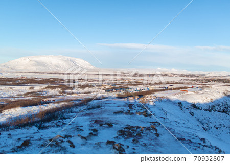 Iceland's incredible fields and plains landscape in winter. The ground is covered with snow. Large spaces. The beauty of winter nature Iceland's incredible fields and plains landscape in winter. The ground is covered with snow. Large spaces. The beauty of winter nature 70932807