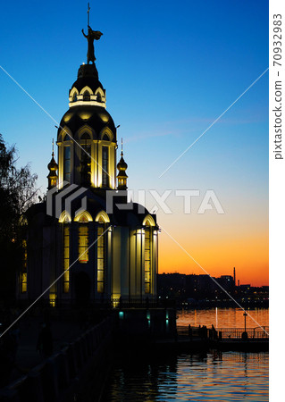 Christian temple by the water at sunset 70932983