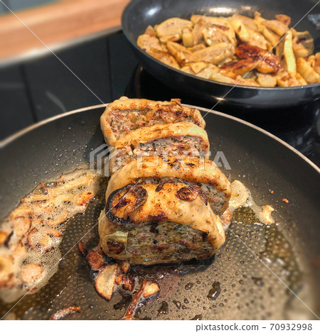 the delicious Swabian speciality Maultaschen fried in a pan the delicious Swabian speciality Maultaschen fried in a pan 70932998